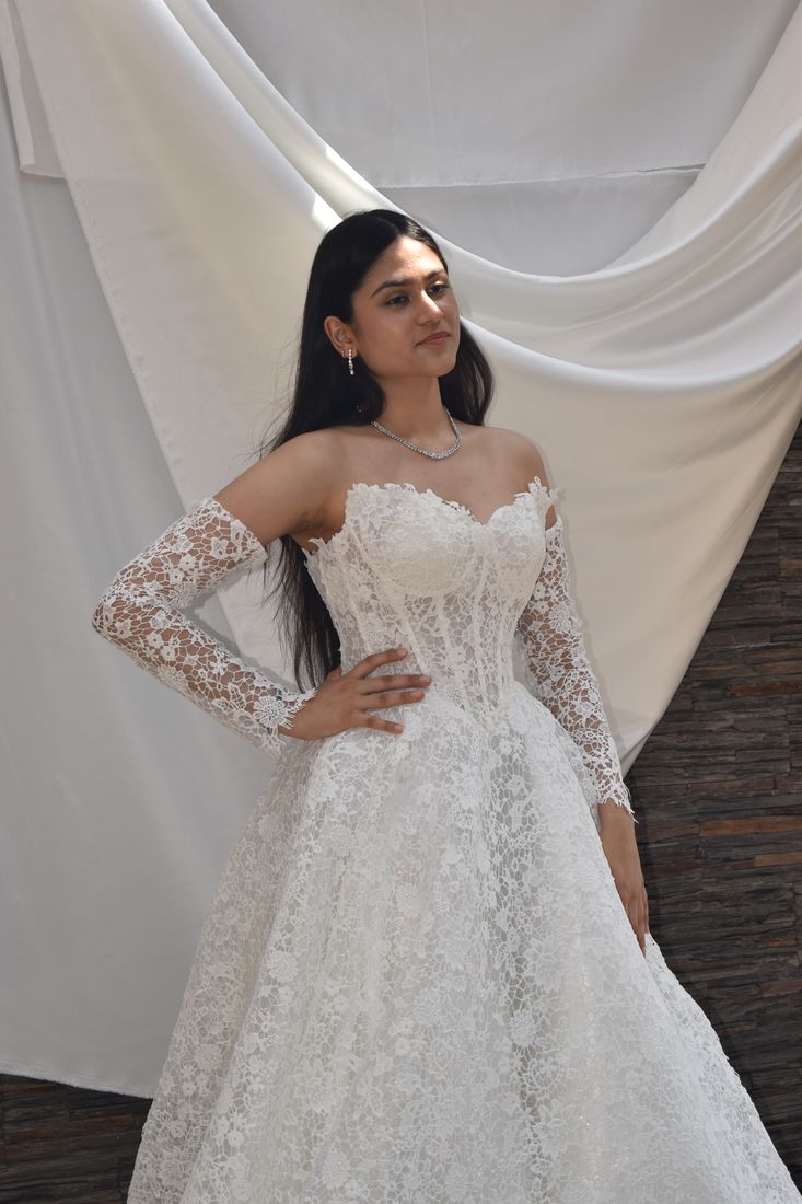 Lace wedding gown with long detachable lace sleeves added at the store